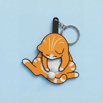 Anti-stress keychain in the shape of a cat and egg.